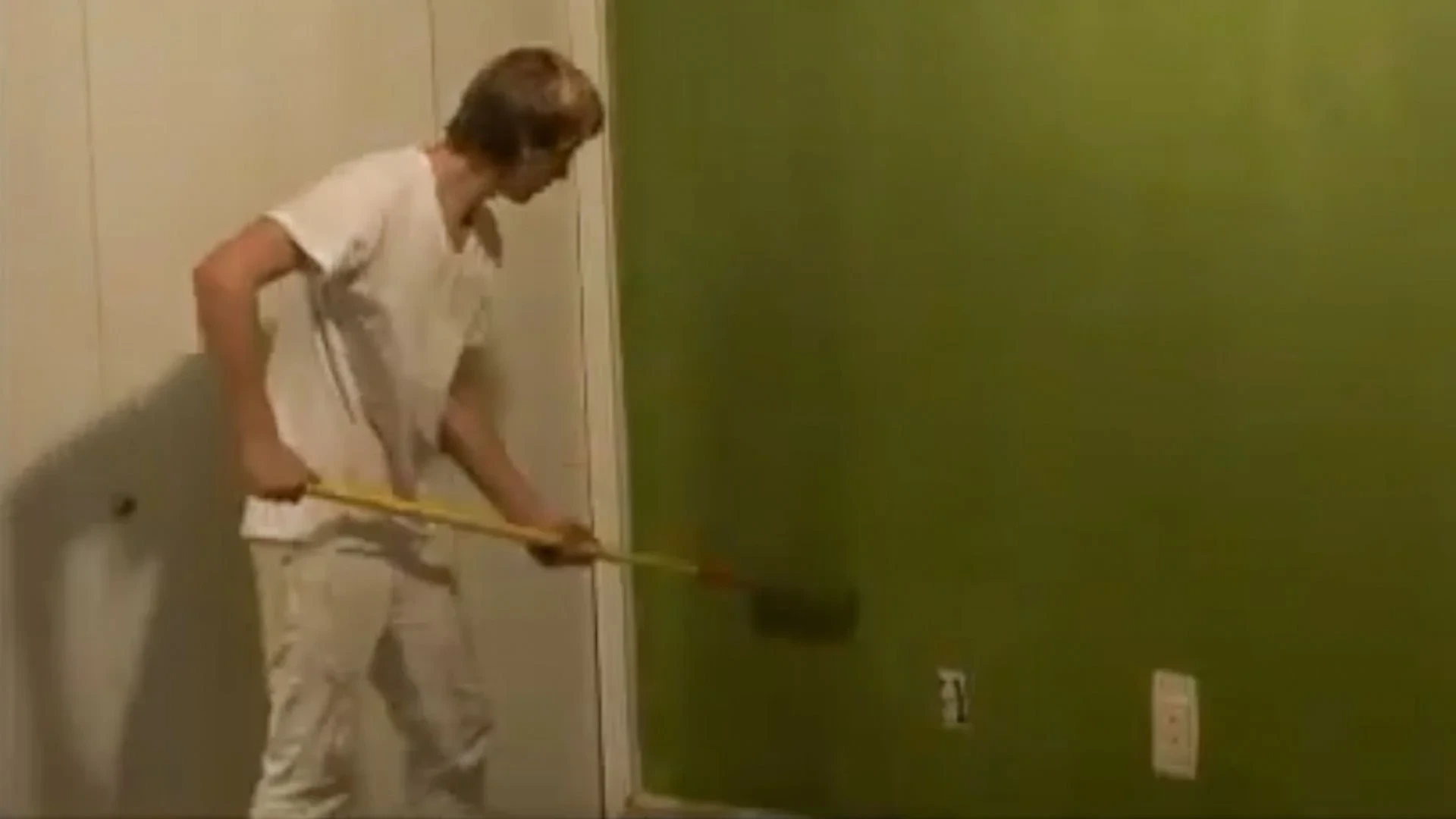 Founder Steven painting a wall in his early That 1 Painter days.